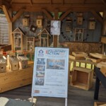 A view of the ACE kiosk at Abridge Garden Centre, showing the range of upcycled wooden goods on sale